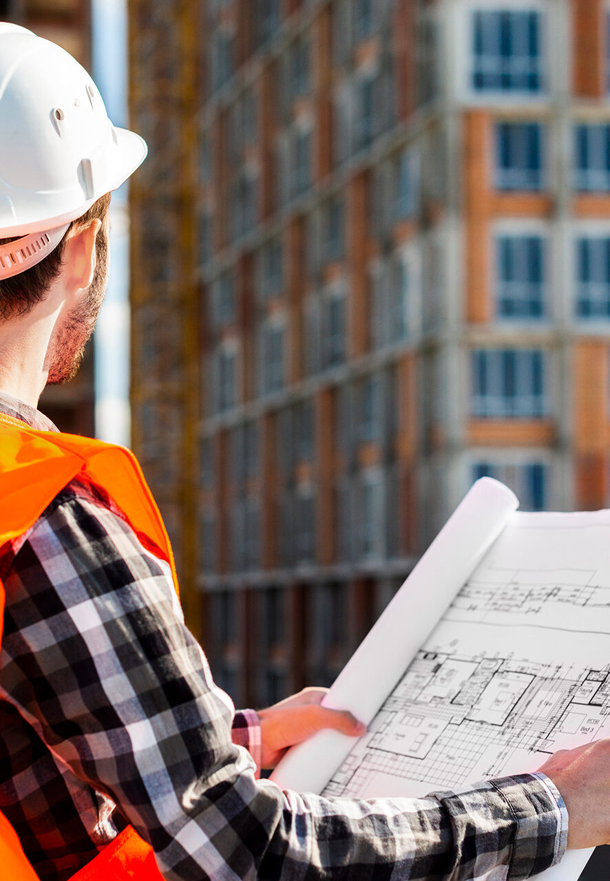 medium-shot-side-view-engineer-holding-plans